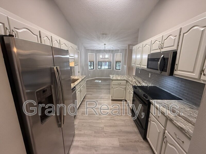 Inviting 3 Bedroom Home in the Heart of Pace with Granite Finishes and a Spacious Screened Porch! property image