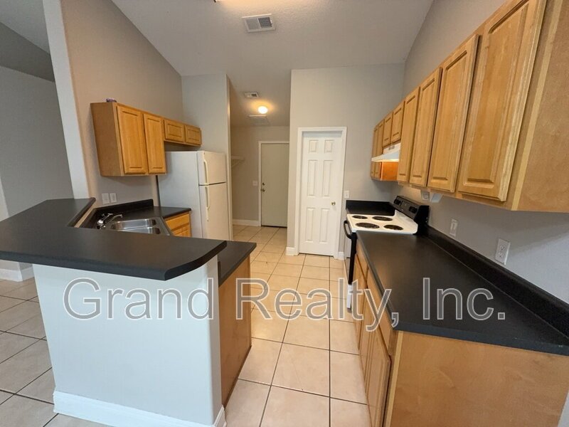 Cute 2-Bedroom, 2-Bath Duplex at 6901 Ella St, Bagdad, FL 32583 - Your Perfect Rental Home Awaits! *Lawncare included!* property image