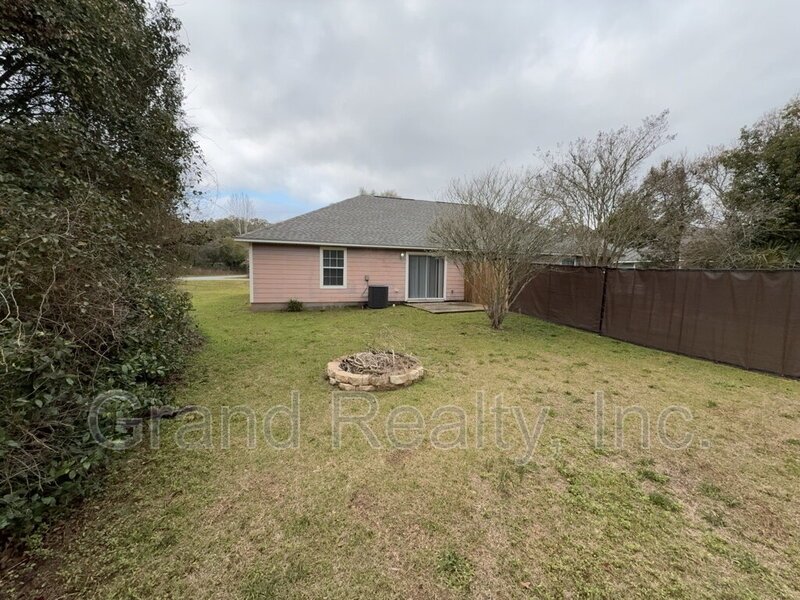 Cute 2-Bedroom, 2-Bath Duplex at 6901 Ella St, Bagdad, FL 32583 - Your Perfect Rental Home Awaits! *Lawncare included!* property image