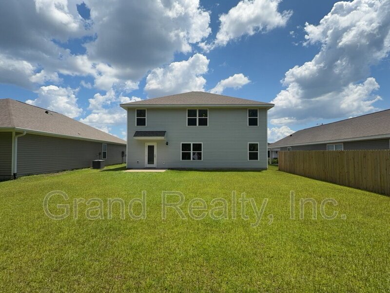 Expansive 5-Bed, 3-Bath Family Home in Pace, FL – 2,556 Sq Ft | 5431 Peach Drive! property image